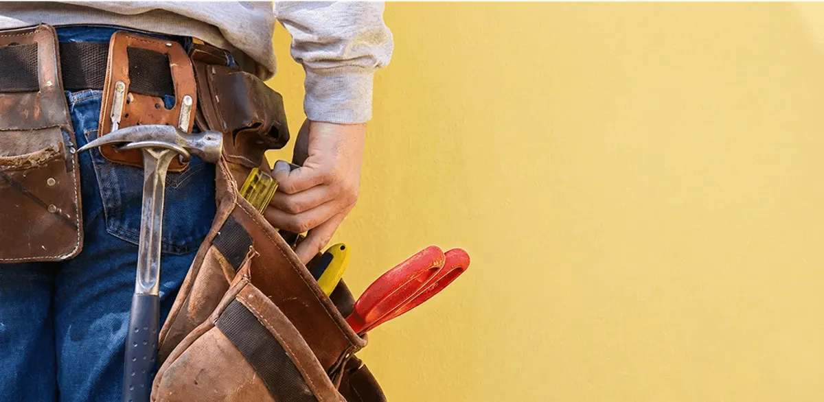 Handyman with tool belt ready for home repairs and maintenance in Lakeland, FL